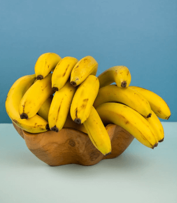 In this example, we clone a bunch of bananas 4.5 times and arrange the clones in 3 columns. Since the last PNG copy is not complete (it's only 0.5 of the image), the program cuts the banana bunch in half, leaving only the top half of the PNG. In areas where the image clones are not used, we fill with a light yellow color. (Source: Pexels.)