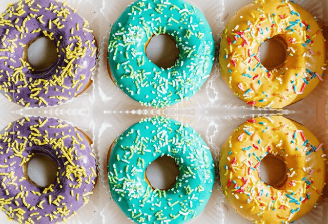 In this example, we load a PNG file with a box of colorful donuts and apply the reflection along a horizontal line that goes through the center of the box. The horizontal line is drawn at the position y = 207 and it reflects the bottom donuts upwards. Now we have two rows of donuts of the same color at the top and bottom. (Source: Pexels.)