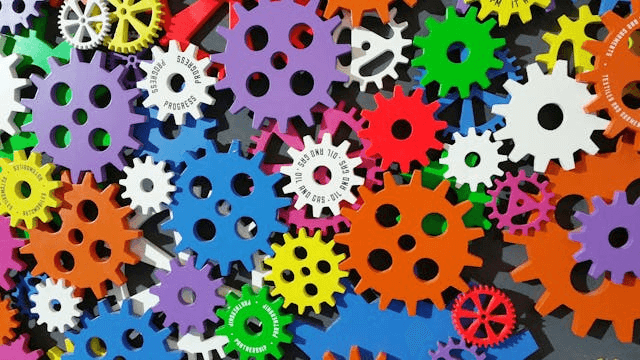 In this example, we upload a PNG photo of colorful toothed toy gears and sort its pixel blocks by warmth – from cool hues like blue and cyan to warmer colors like orange, red, and purple. The photo is split into 10×10 blocks and sorted from top to bottom, starting at the upper left corner and going to the lower right corner. We also activate the "Move Grayscale Pixels" option with a threshold value of 25%, which puts all monochrome pixels (within a 25% radius of pure white or pure black) at the end of the sorted pixel sequence. (Source: Pexels.)