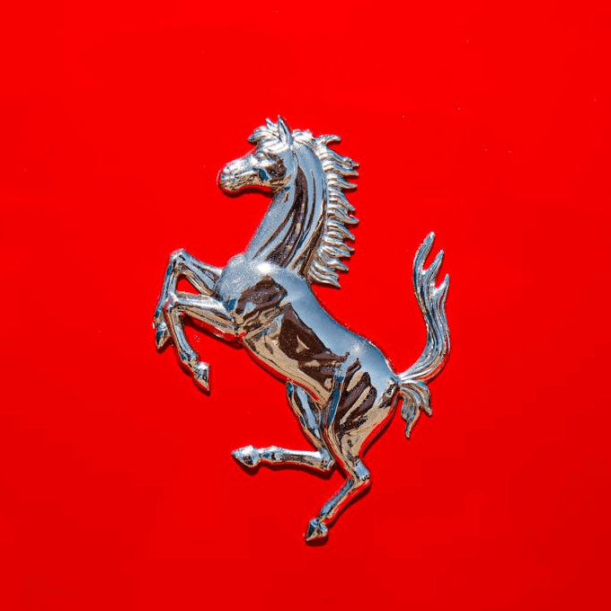 This example transforms a PNG file of the Ferrari emblem into an elegant oval stamp. To clearly highlight the prancing horse figure in the stamp, we adjust the brightness balance to 160%, which enhances the lighter areas and helps define the silhouette of the horse. We add an oval border featuring a sequence of stars to the stamp, and color the entire stamp in fire brick color, matching the classic Ferrari hue. (Source: Pexels.)