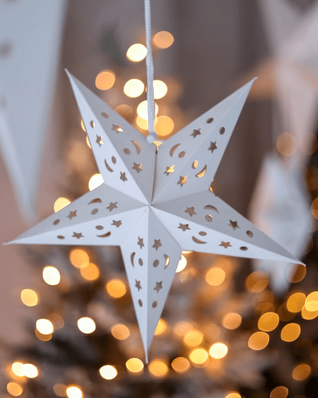 In this example, we're cutting a PNG photo into the shape of a classic five-pointed star. First, we upload a high-quality PNG of a paper star ornament into the tool's editor. Then, we apply a star-shaped mask that has 5 spikes and set the spikiness to 0.66. To make the cut shape precisely align with the paper star ornament in the photo, we set the star phase shift to 33 degrees, which slightly rotates the star mask counter-clockwise. This way, the cut matches the actual star in the photo, creating a clean and accurate cut. (Source: Pexels.)