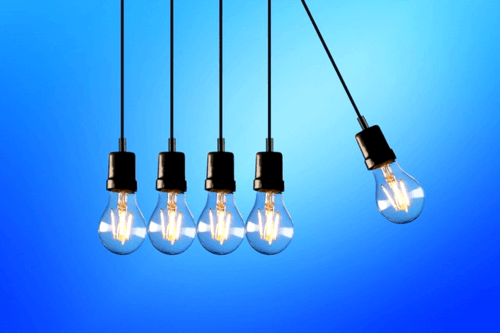 In this example, we decrease the high contrast of a PNG photo of light bulbs. In the options, we enter a new contrast value equal to 60%, which makes the pixels in the PNG 40% grayer. The area of the contrast change is equal to the area of the whole PNG photo. (Source: Pexels.)