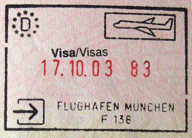 In this example, we're working with a visa stamp from a German passport. When a traveler arrived in Munchen, this stamp was printed in her passport. Now we want to separate it from the passport's paper color. We can do it quickly by picking the passport page's color and setting the color similarity index to 22%, which matches lighter and darker passport page shades. We also make the pixels at the edges of the stamp slightly transparent to fully remove any leftover background. (Source: Wikipedia.)