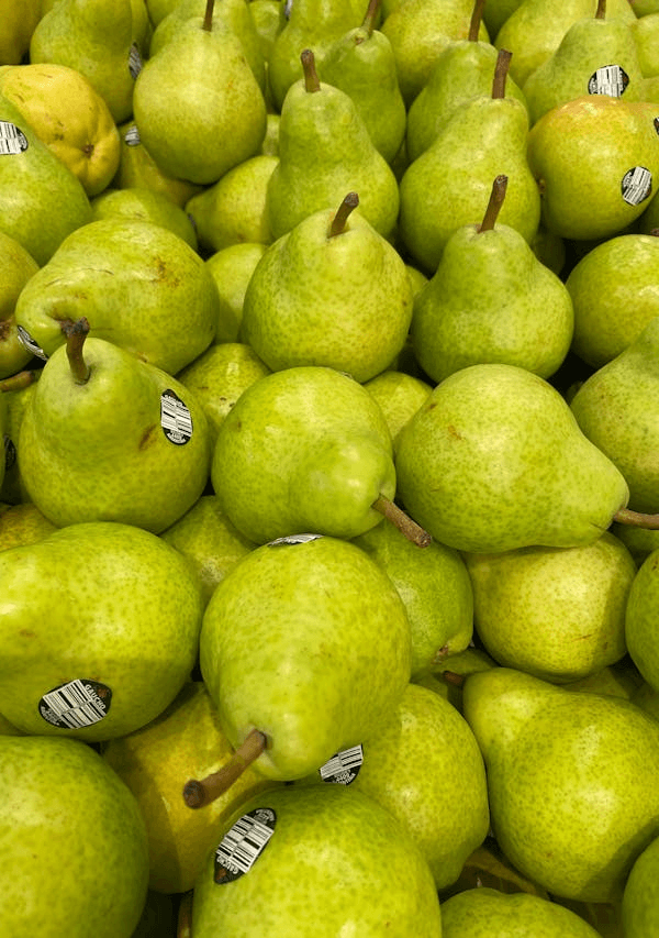In this example, we modify a PNG photo of green pears to make it fit a 4:5 aspect ratio required by the farm website's CMS. To do it, we use the "Fit to Canvas" mode. This mode scales the photo until any two of its sides touch the edges of the new canvas, ensuring the entire photo is still visible without any cropping. The PNG is scaled down to fit the new size of 400 by 500 pixels, preserving its aspect ratio. The empty areas are left transparent, making the photo ready for use on a website where it will blend seamlessly with the background. (Source: Pexels.)