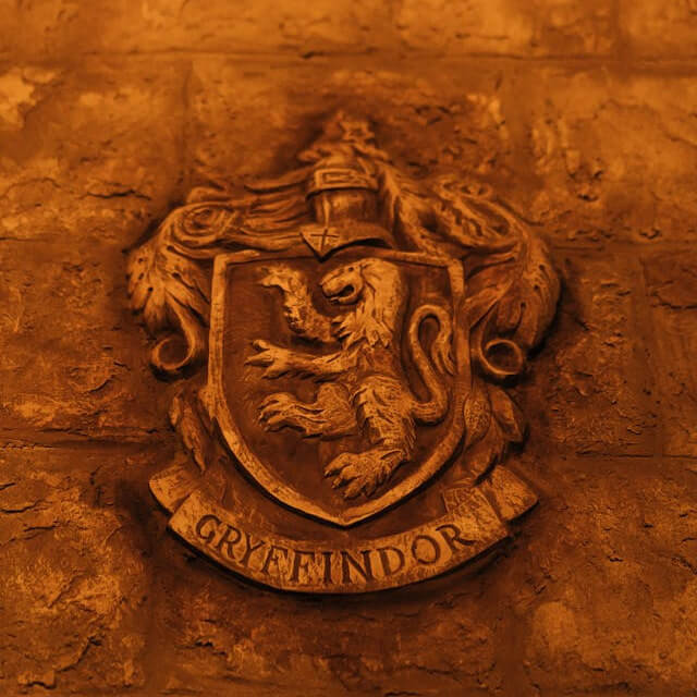 In this example, we create a round stamp from the Gryffindor crest (in JPEG format) for decorating Harry Potter-themed party invitations. To do it, we cut a circular portion with the emblem out of the JPEG, apply a see-through (transparent) background, and use a solid black color for both the stamp imprint and the border arund it. The stamp is surrounded by a simple circle frame, which blends with the emblem. There's also a 10-pixel outer padding around it to give it more visual space when it's applied on the invitation cards. (Source: Pexels.)