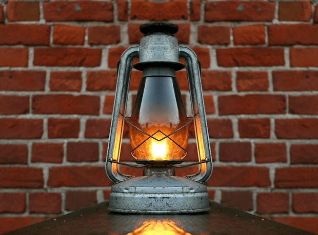 In this example, we create a vertical line symmetry from a PNG photo of a kerosene lamp. We set the vertical plane of symmetry at the position x = 330, select the right side of the image, and activate the "Swap Symmetrical Parts" option (so that the symmetric copy of the photo is drawn along the left side). The original photo has a wooden background on the left and a brick background on the right, however, the symmetrized photo has a brick background on both sides. (Source: Pexels.)