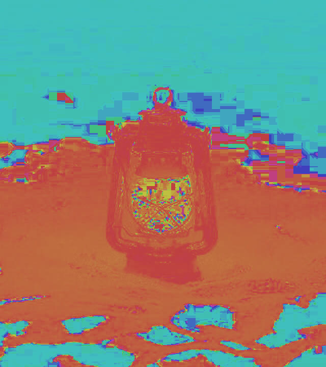 In this example, we convert a PNG image of a lantern lamp into the hue component of the HSL color model. The hue channel accurately portrays the colors of all PNG pixels, utilizing shades from the spectrum of visible light. This allows us to clearly see that the warm light from the lantern creates orange pixels of warmth on a cool blue background. (Source: Pexels.)