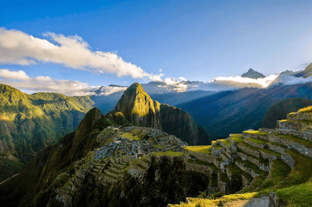 In this example, we randomize the pixels in a Machu Picchu photo by shifting each one no more than a single position from its original location. This means each block can swap places only with an adjacent block but cannot move further. The blocks are 34 pixels in size, and the incomplete blocks at the right and bottom edges are shuffled separately from complete ones. This process creates an interesting randomization effect, where the shifted pixels of the sky and mountains remain approximately aligned with their original positions. (Source: Pexels.)