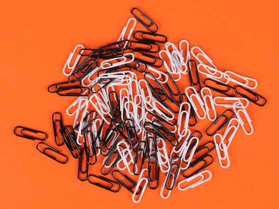 In this example, we load a PNG image of a pile of paper clips and separate it into individual color layers. We use the "Extract Quantized Colors" option to divide the image into three colors. This option automatically identifies the three most used colors in the PNG, and the tool then creates three separate images, each displaying one color layer. (Source: Pexels.)