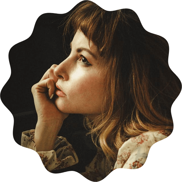 In this example, we add a wavy outline to a portrait of a beautiful woman. To do it, we select the wavy cut shape from the tool options and set the wave frequency to a soft value of 12, which creates 12 peaks around the edge. The amplitude of peaks is set to 0.1, which is 10% of the portrait's size. As a result, a delicate, wavy frame gets created around the woman's portrait. (Source: Pexels.)