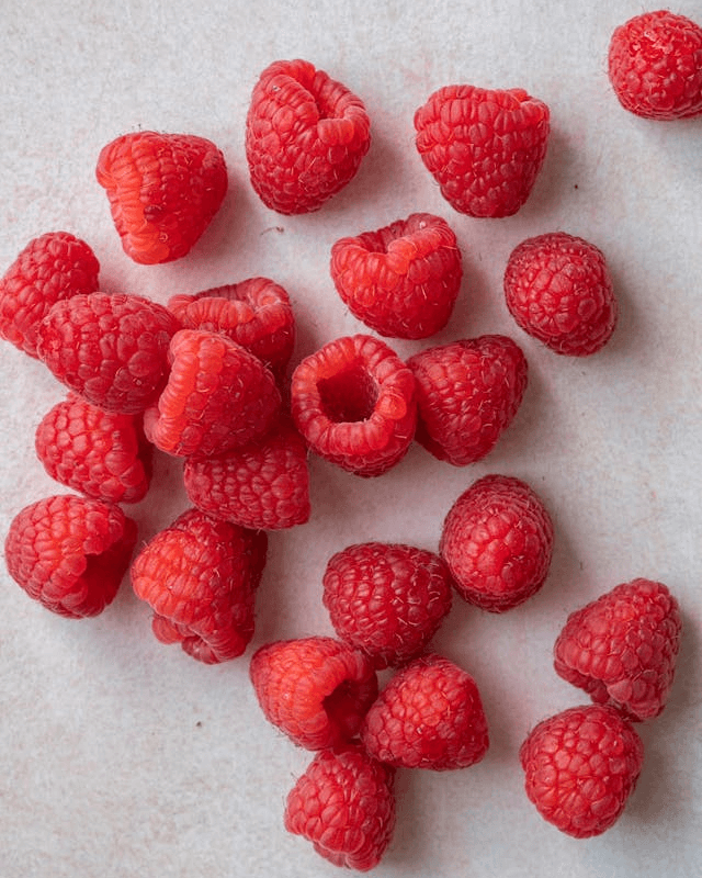 In this example, we sort the pixels of a raspberry PNG image by their saturation. The PNG is divided into 6×6 pixel blocks, and each row is sorted separately in increasing order of saturation. This sorting method shifts all gray background pixels to the left while the richly saturated crimson tones of raspberries move to the right. (Source: Pexels.)