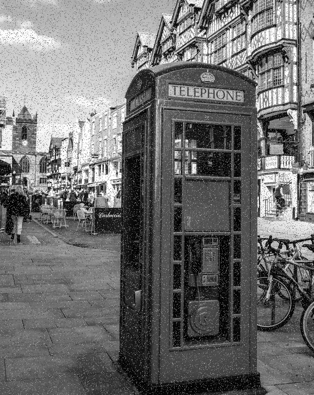 In this example, we create a retro-style PNG photo of a UK phone booth. To immerse ourselves in the 20th-century atmosphere, we turn the PNG photo into grayscale. We choose the monochrome noise mode and add random gray tone pixels to 10% of the photo area. (Source: Pexels.)