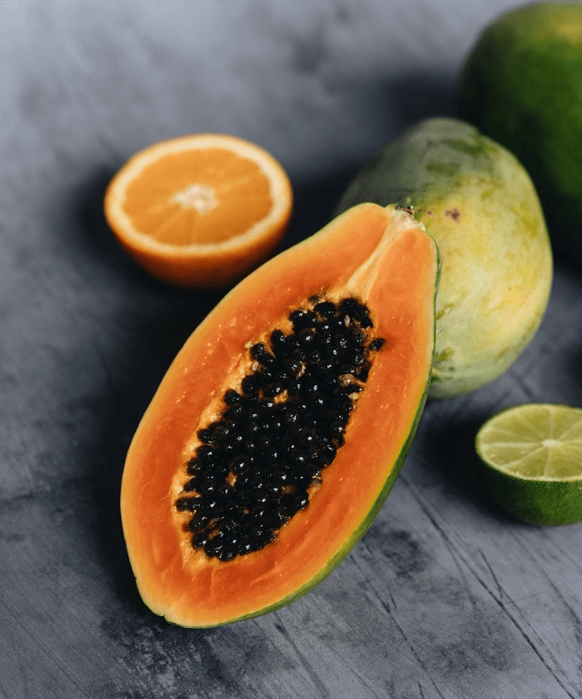 In this example, we use the eyedrop tool to select one color from a close-up PNG photo of a sliced papaya. We click on the photo in the input with the mouse and get the "Chocolate" color, which is also printed in 10 other color formats such as #cd531a in hex. (Source: Pexels.)
