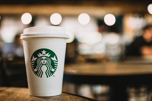 In this example, we redact the Starbucks logo from a PNG image of a coffee cup. We apply the pixel censoring method and cover the logo with 15×15 pixel thick squares. (Source: Pexels.)