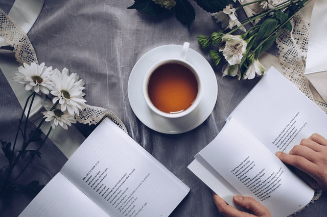 In this example, we perform a horizontal shift on a PNG image of a teacup and books. We enter the shifting factor equal to 0.4, which means that the program cuts off 40% of the PNG on the right side and moves it to the left side. (Source: Pexels.)
