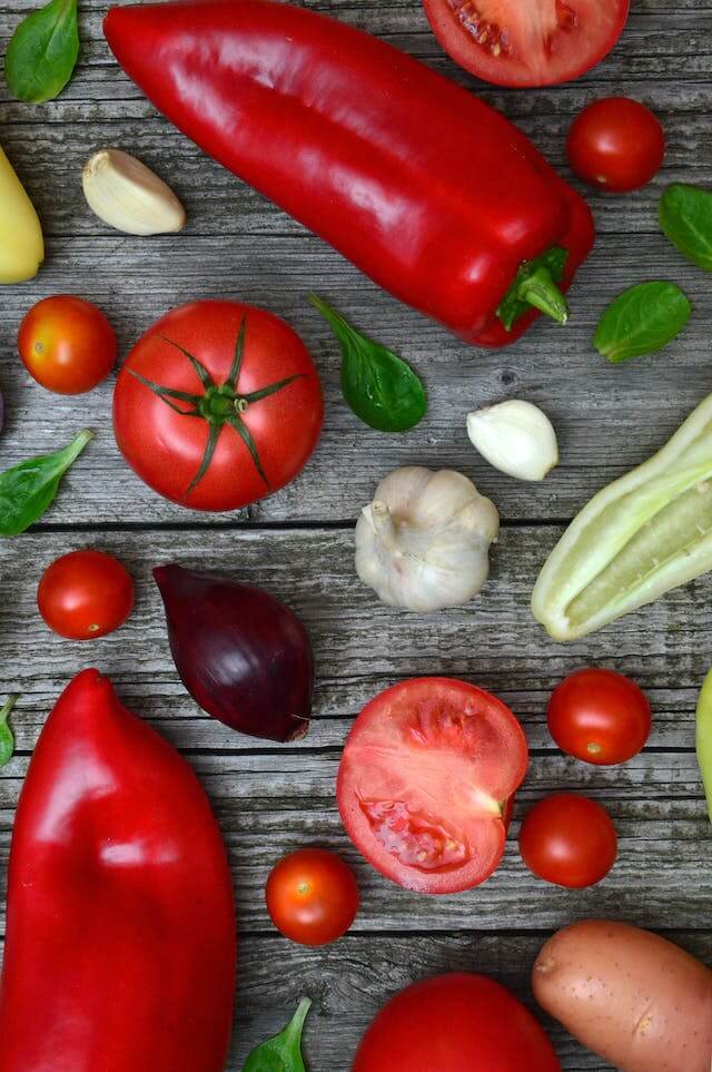 In this example, we investigate the color saturation of different vegetables in a PNG image. To do this, we convert the PNG into the saturation channel of the HSL color model. As a result, we find that the peppers and tomatoes have the highest saturation, while the garlic has the lowest saturation. (Source: Pexels.)