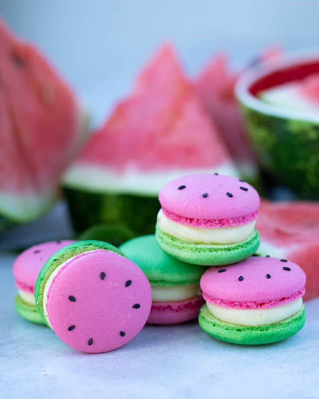 This example demonstrates a PNG image of watermelon macaroons under the prism of grayscale tones. At first glance, the images may seem indistinguishable, but upon closer inspection, it becomes apparent that in the red channel, bright watermelon pixels indicate a red hue, in the green channel, dark tops of macaroons lack a green tint, and in the blue channel, bright macaroons and a dark watermelon indicate the presence of blue in macaroons but not in watermelon. (Source: Pexels.)